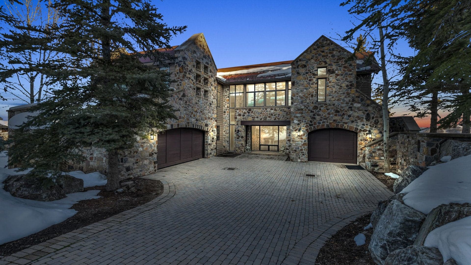 The driveway leading up to this luxury Park City vacation rental is made of concrete bricks.