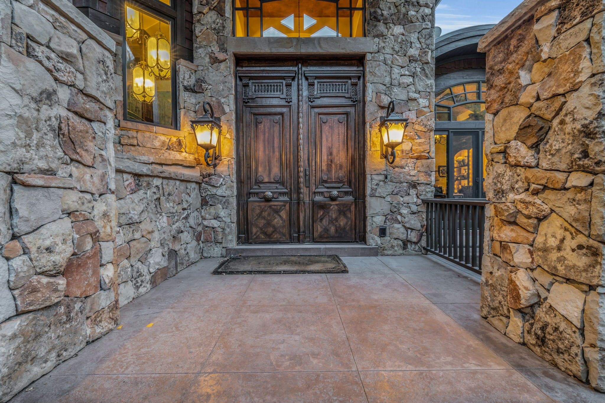 Morning Star front door exterior with two lanterns and stone pathway.