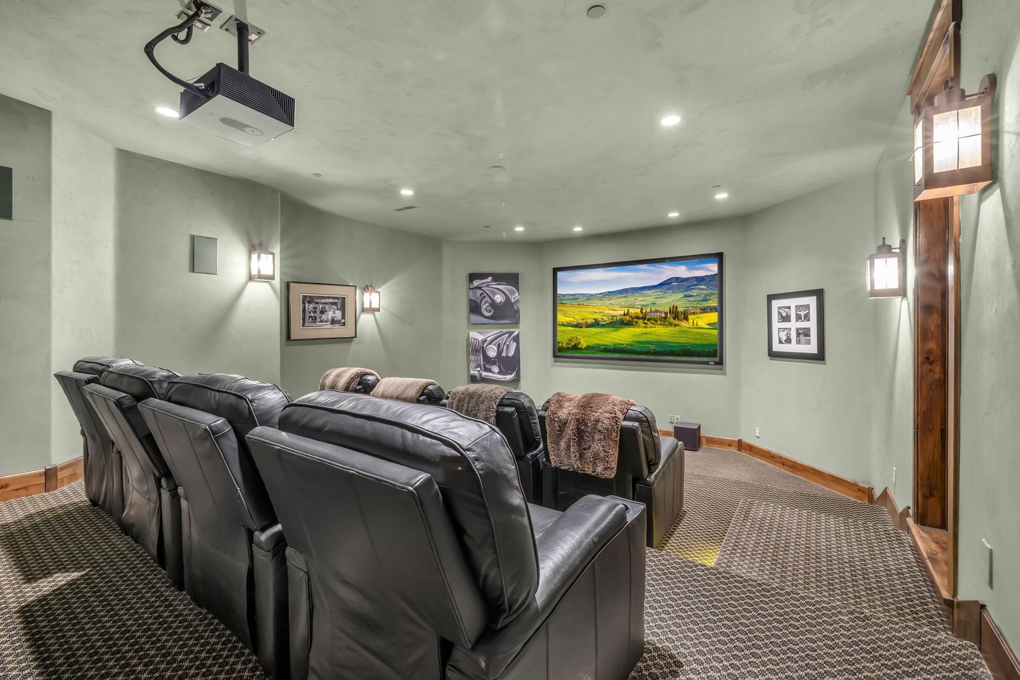 Game room with lounge chairs and a projector, Luxury Park City vacation rentals.