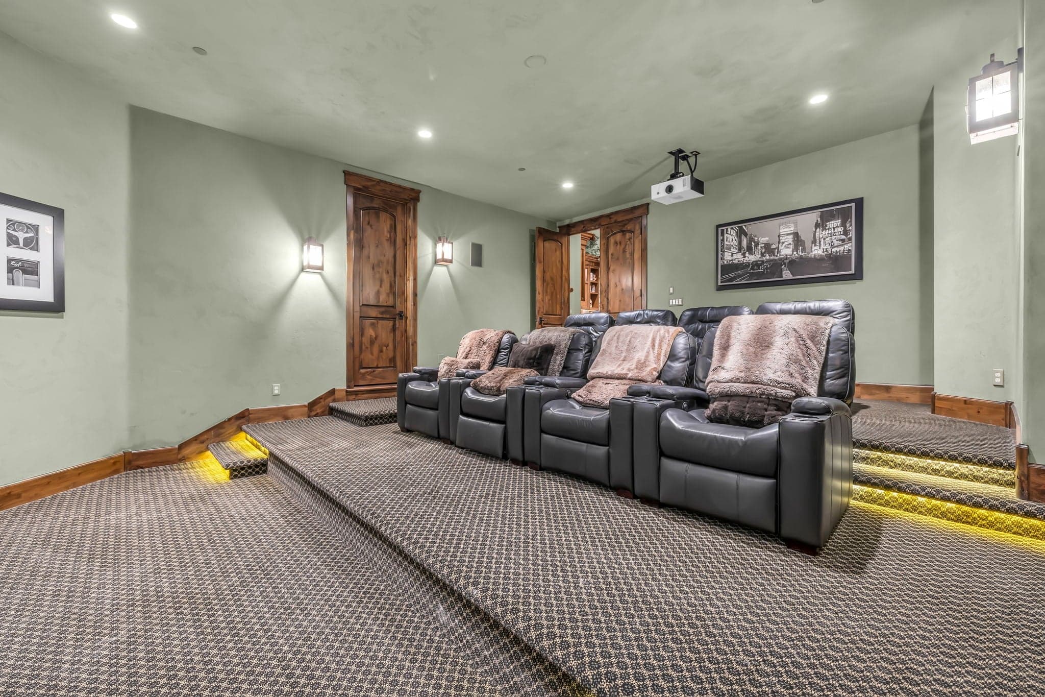 Game room with lounge chairs and projector, Luxury Park City vacation rentals.