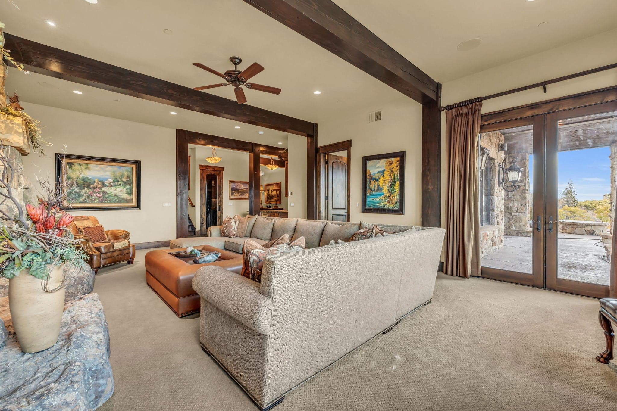 Morning Star upstairs loft with outdoor access, paintings, ottoman and marble table.