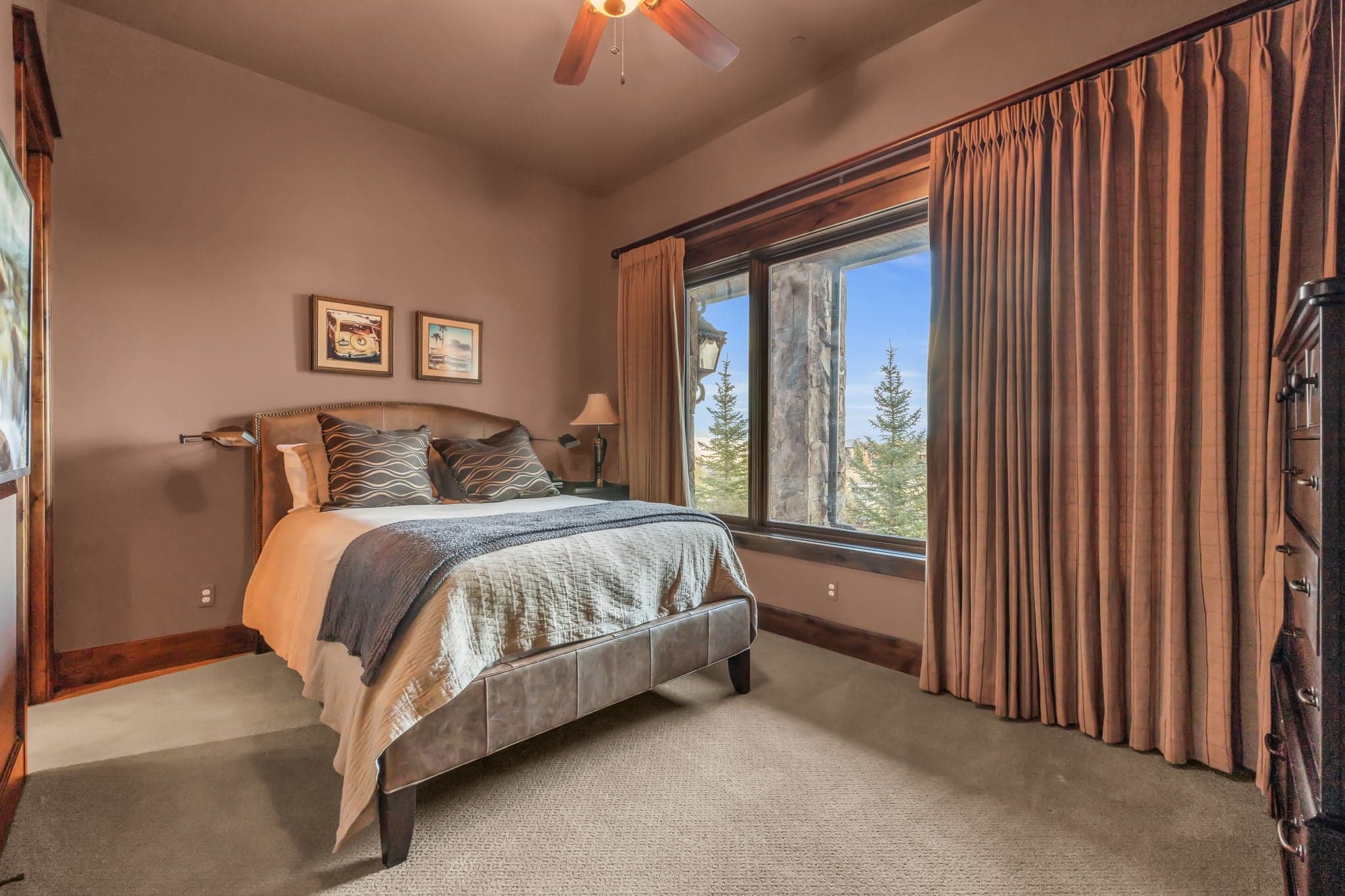 Bedroom with twin bed upstairs with two outdoor windows.