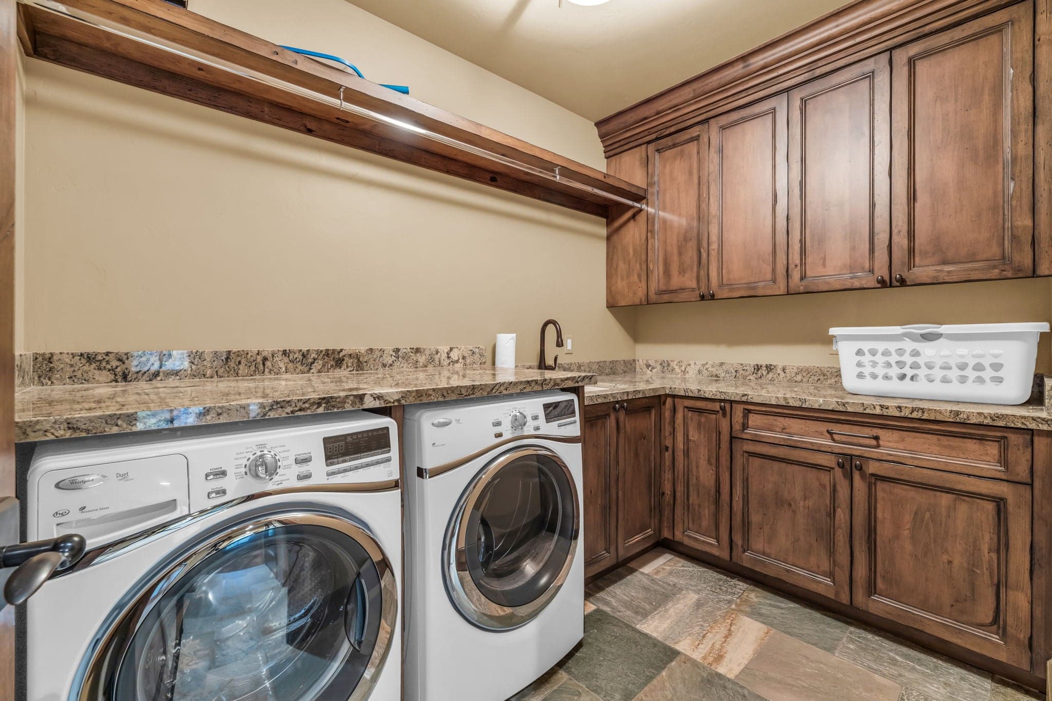 Washer and dryer at Morning Star  with a sink and hamper.