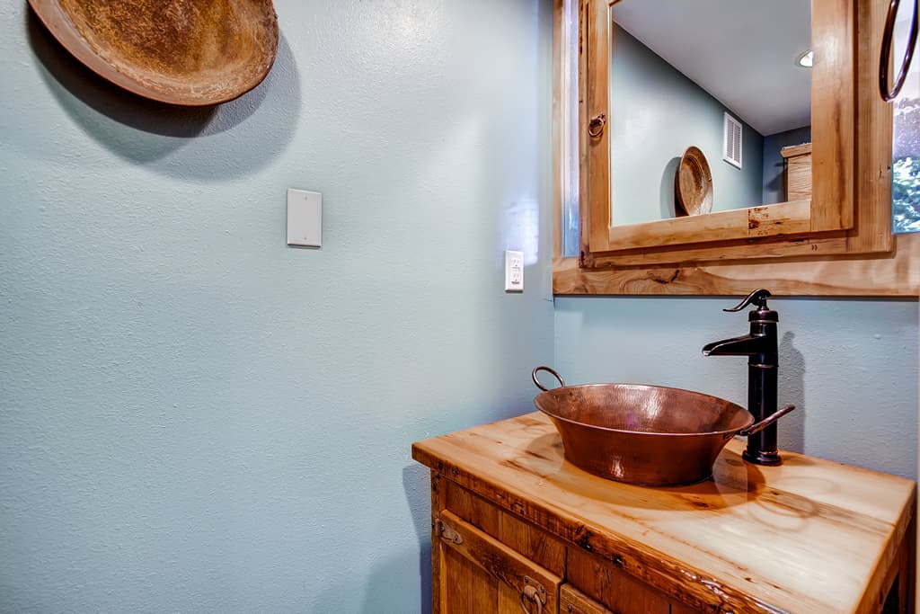 Half bath located off the living room - 4 O'Clock Lodge D26 Breckenridge Vacation Rental