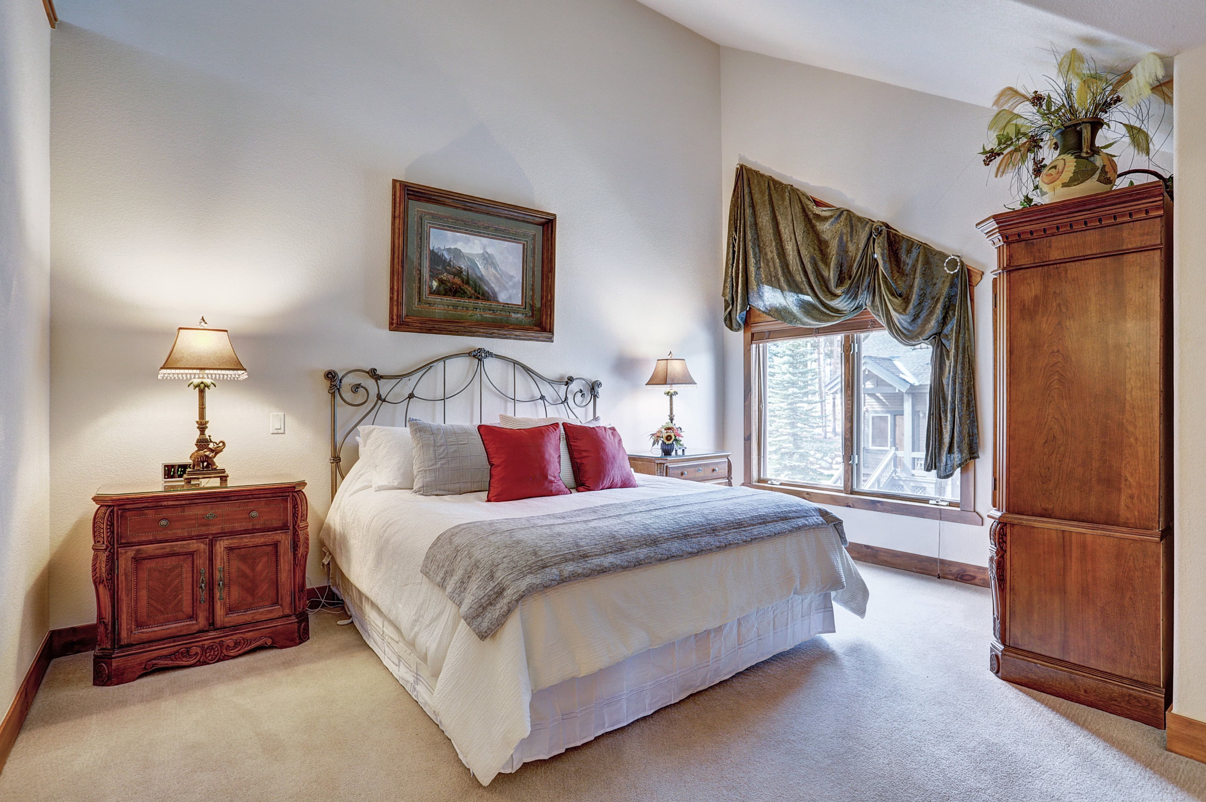 Primary bedroom with natural light and vaulted ceilings - Amber Sky Breckenridge Vacation Rental