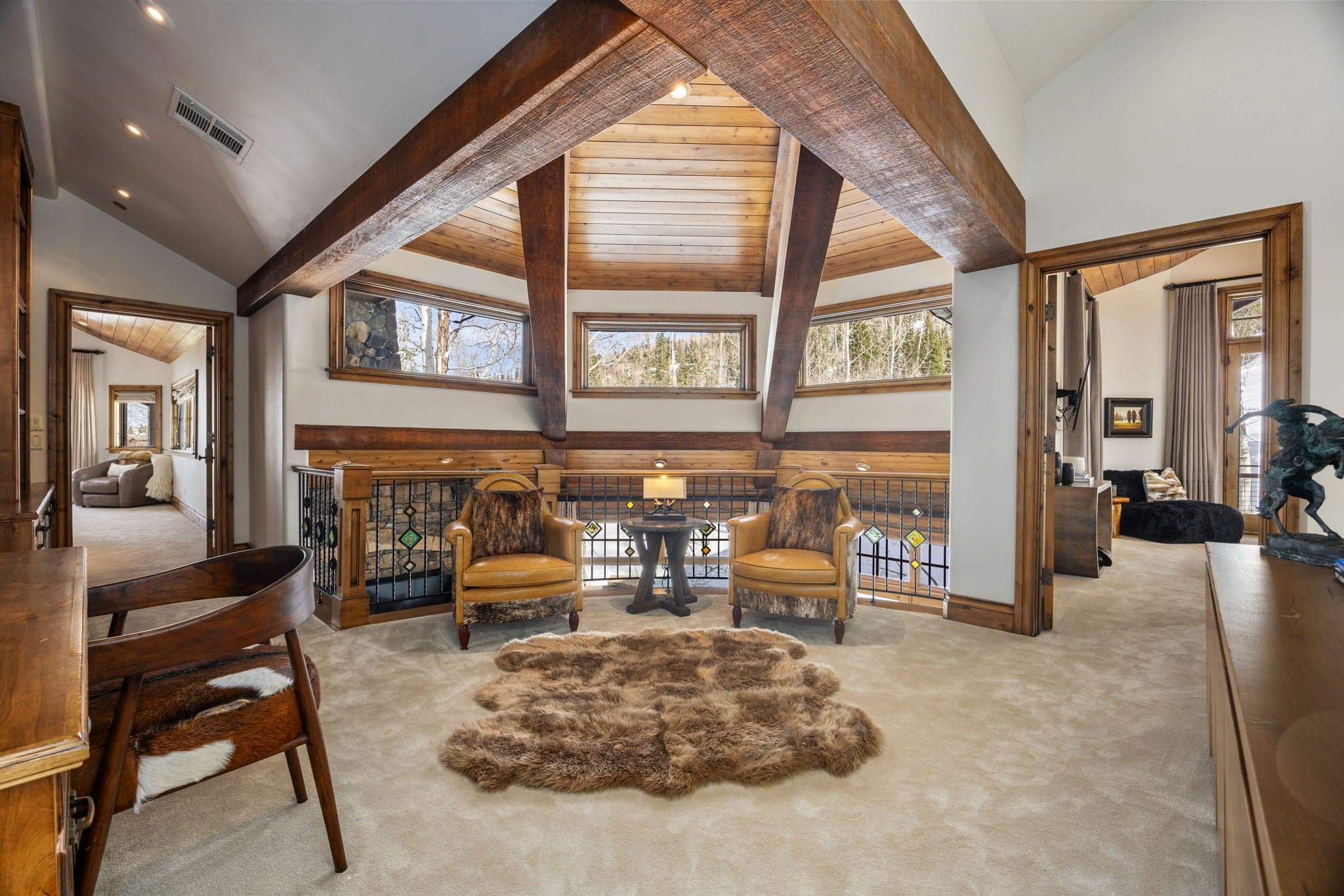 Upstairs seating area with large windows overlooking the mountains