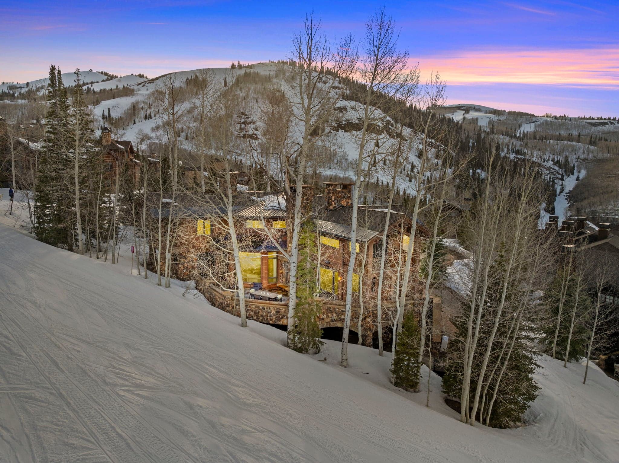 A view of Ski Utah home from the slopes, you can see the home is about 20 feed away from the run, with views of more ski runs in deer valley behind the home