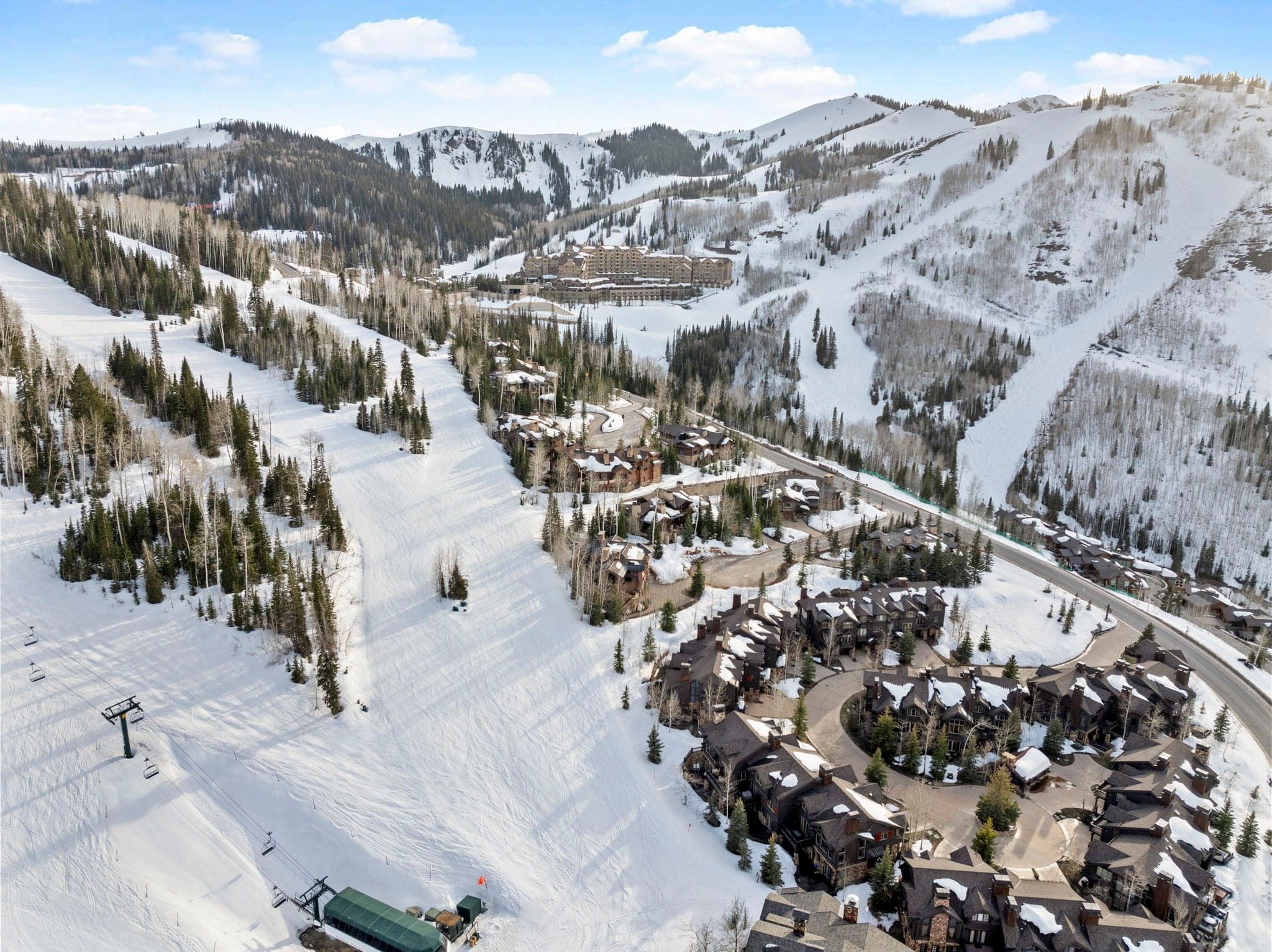 areal view of deer valley empire pass ski area and home visible next to a large ski run